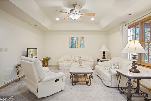 living room with carpet flooring and plenty of natural light