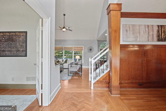 entrance foyer with ceiling fan and high vaulted ceiling