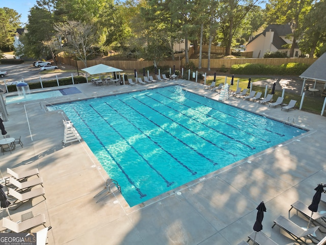 view of pool featuring a patio