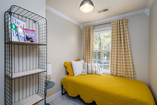 tiled bedroom with a textured ceiling and ornamental molding