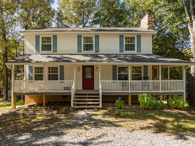 farmhouse inspired home featuring covered porch