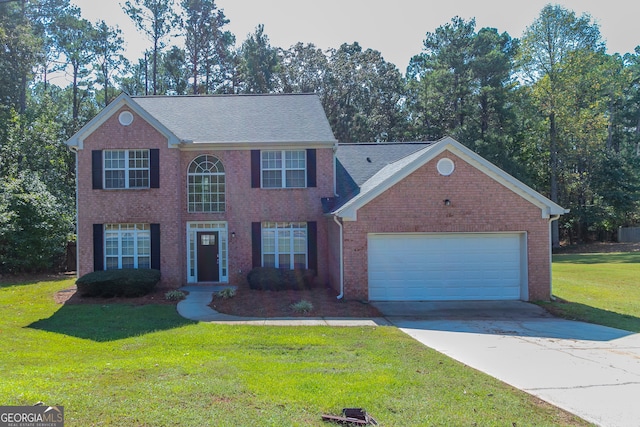 view of front facade with a garage and a front lawn