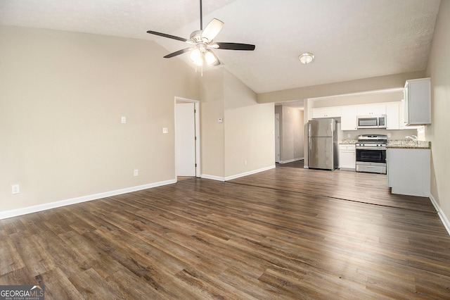 unfurnished living room featuring a textured ceiling, dark wood-type flooring, sink, high vaulted ceiling, and ceiling fan