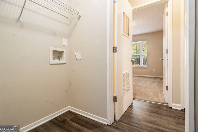 laundry room featuring dark hardwood / wood-style floors and washer hookup