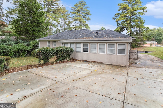 rear view of property featuring a patio