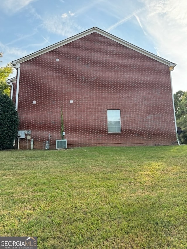 view of home's exterior featuring a yard