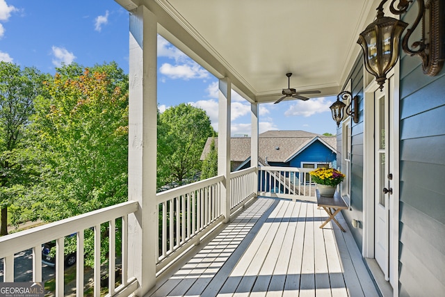 wooden deck with ceiling fan