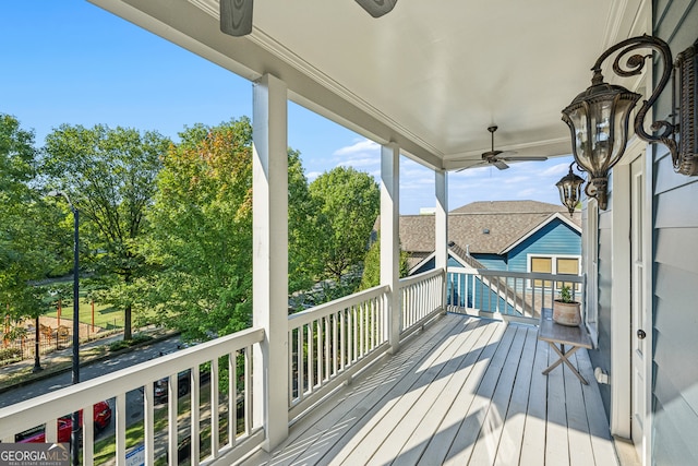 wooden deck featuring ceiling fan