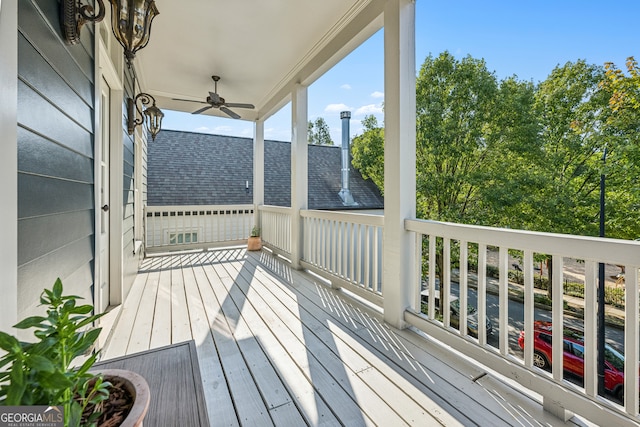 wooden terrace featuring ceiling fan