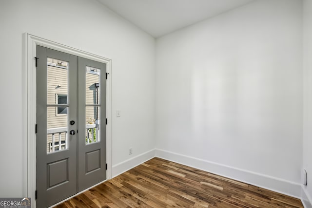 entrance foyer featuring french doors and dark hardwood / wood-style floors