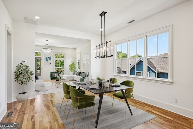 dining room with light hardwood / wood-style flooring