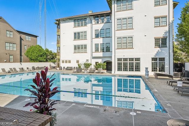 view of swimming pool with a patio area