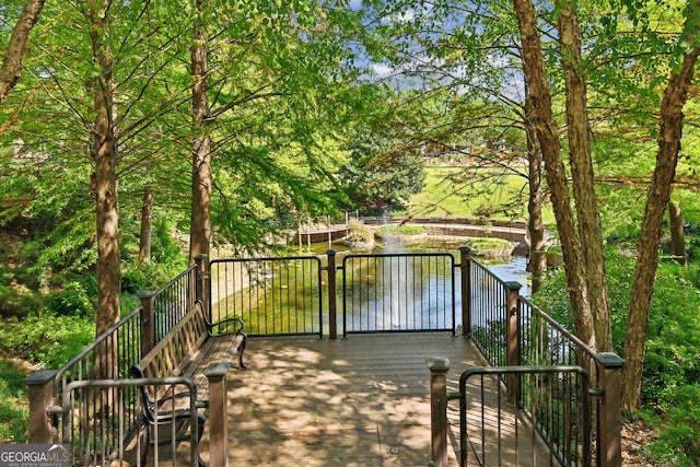 deck featuring a water view