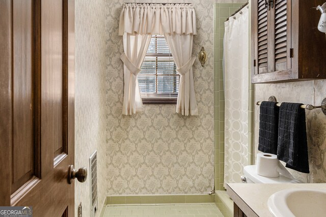 bathroom with vanity, tile patterned floors, and curtained shower