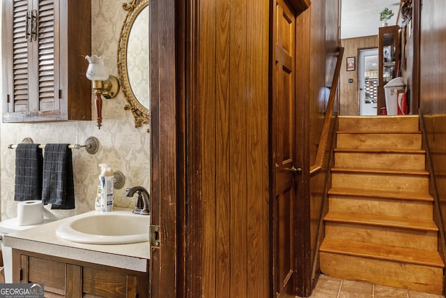 bathroom featuring tile patterned flooring and vanity