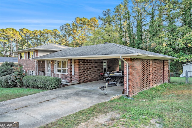 view of front facade with a front yard and a porch