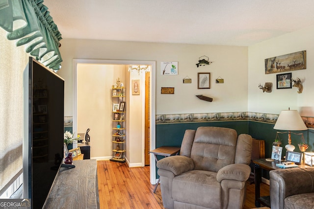 living area with hardwood / wood-style floors