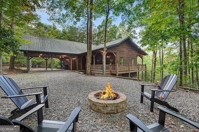 exterior space featuring a patio area and an outdoor fire pit