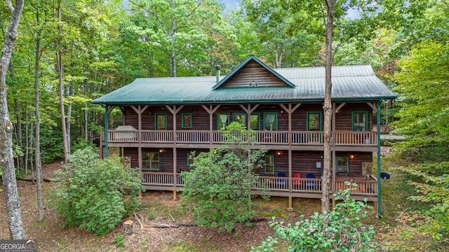 view of front facade with a wooden deck