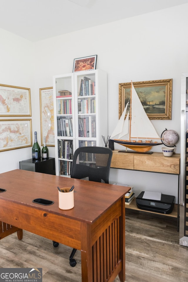 office area with wood-type flooring