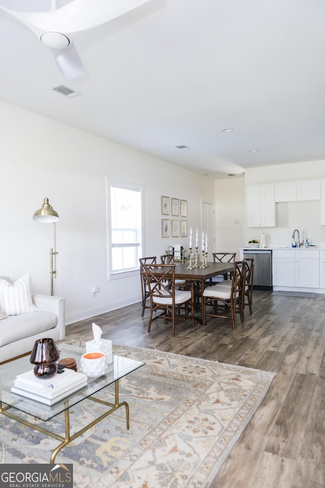 living room with wood-type flooring and sink