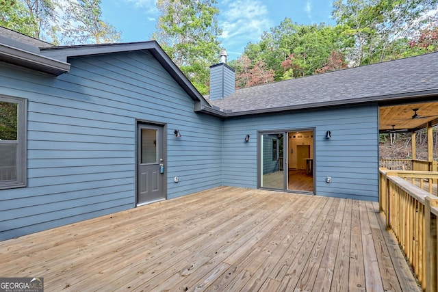 wooden terrace featuring ceiling fan