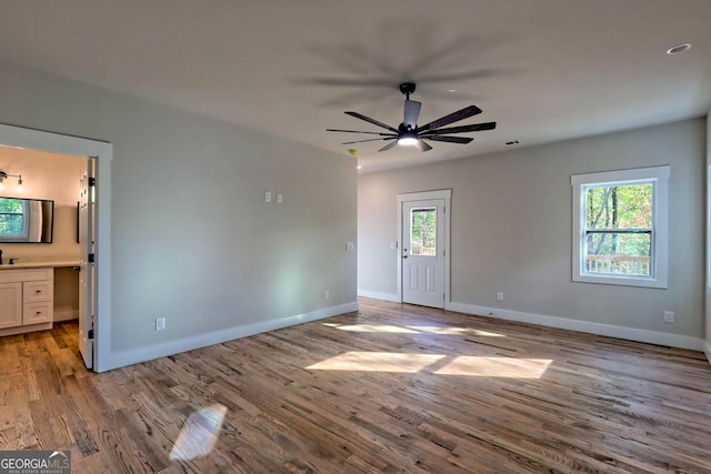 interior space featuring ceiling fan and light wood-type flooring