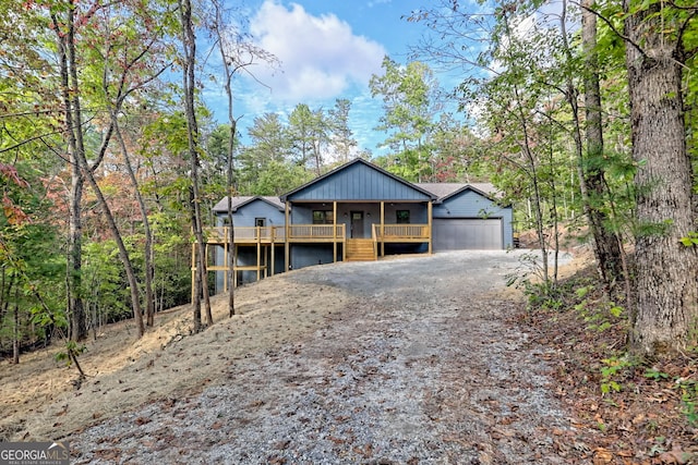 view of front of home with a garage and a wooden deck