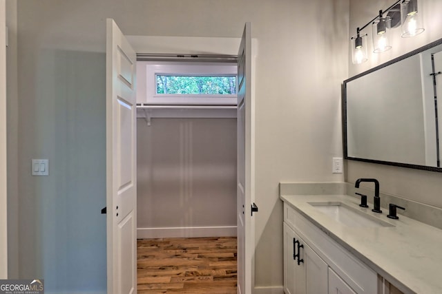 bathroom featuring vanity and wood-type flooring