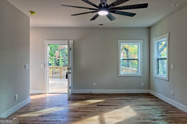 empty room featuring light wood-type flooring and ceiling fan