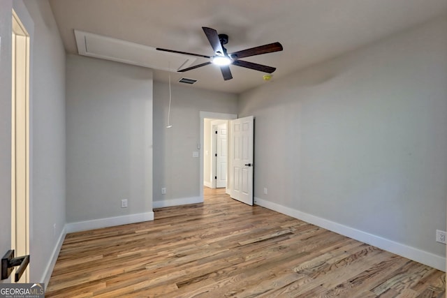 unfurnished room featuring light hardwood / wood-style floors and ceiling fan