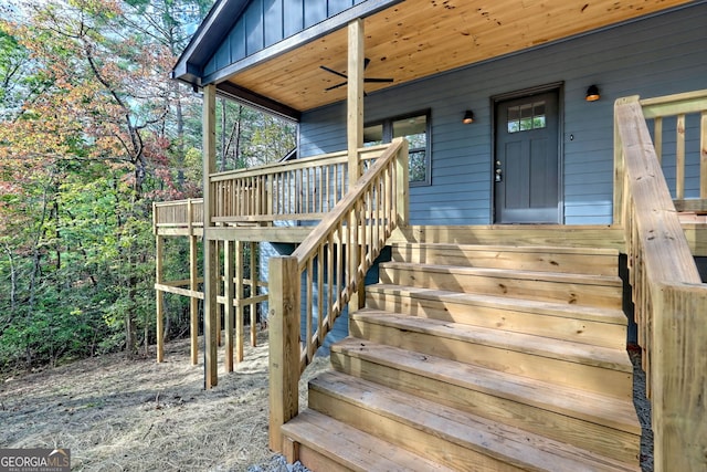 doorway to property featuring ceiling fan and a porch