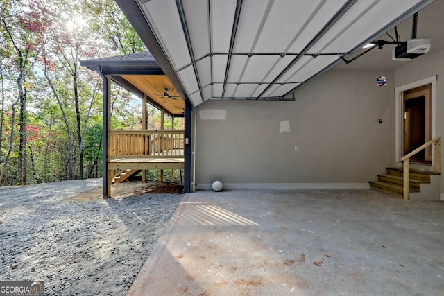 garage with ceiling fan and a garage door opener