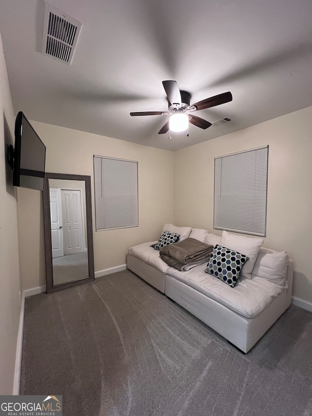 living room with dark colored carpet and ceiling fan