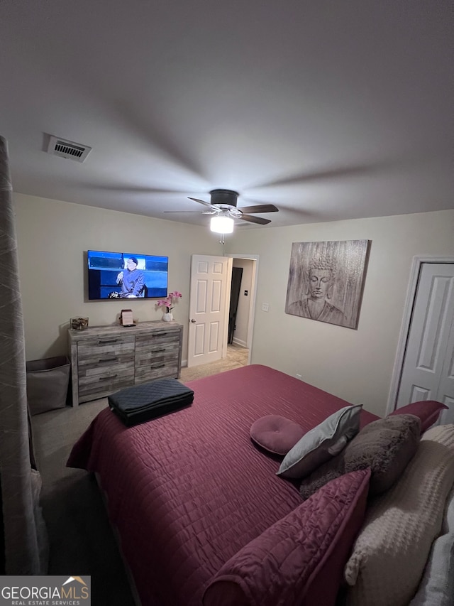 carpeted bedroom with ceiling fan