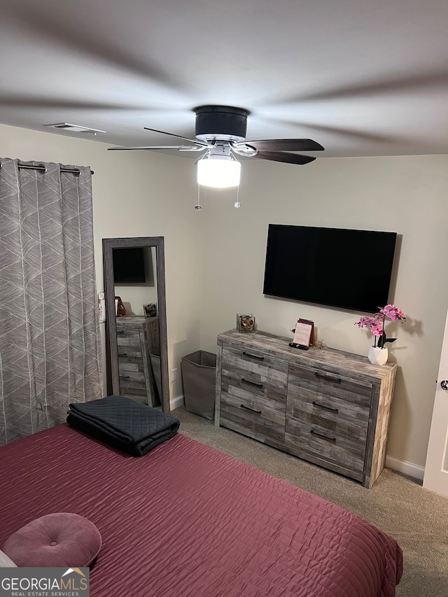 carpeted bedroom with ceiling fan