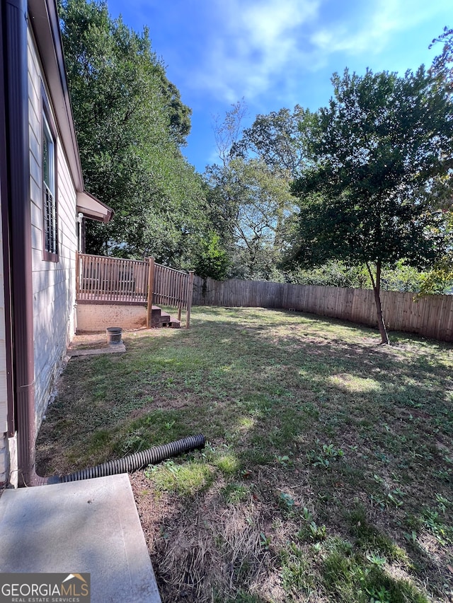 view of yard featuring a deck