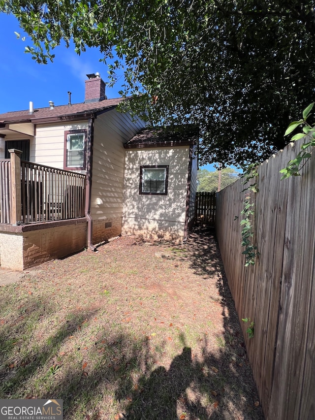 back of property featuring a lawn