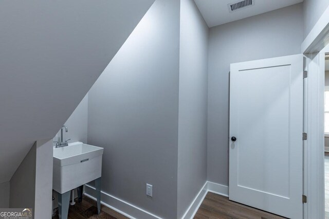 bathroom with ceiling fan, vanity, and wood-type flooring