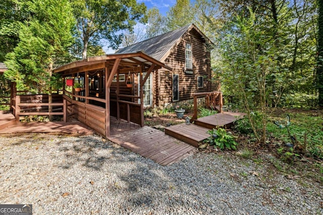 exterior space featuring a wooden deck