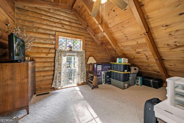 additional living space with lofted ceiling with beams, wooden ceiling, carpet flooring, ceiling fan, and rustic walls