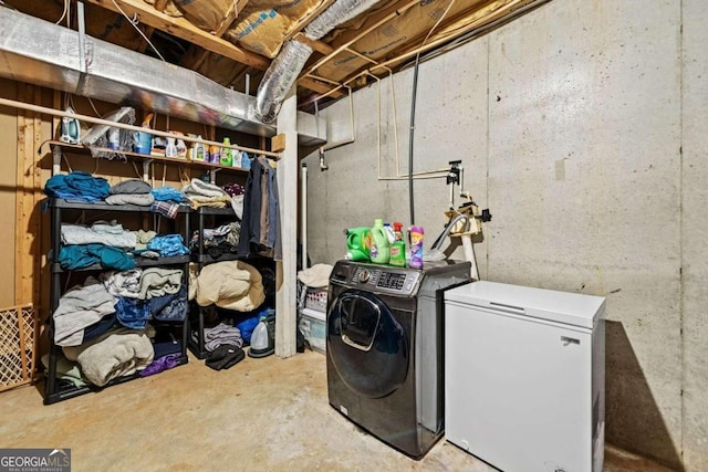 laundry area with washing machine and dryer