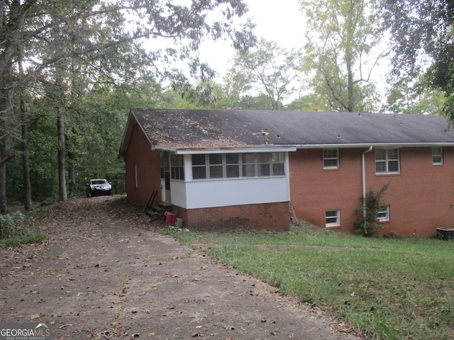 exterior space featuring a sunroom