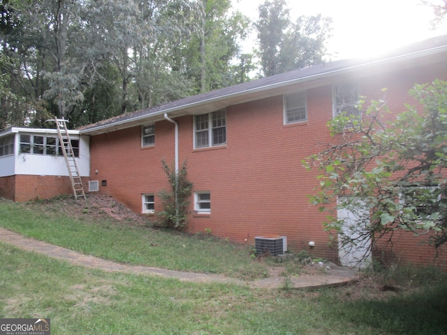 view of side of home with cooling unit