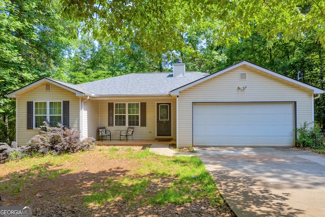 single story home with a garage and covered porch