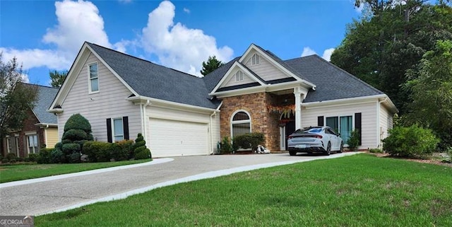 view of front facade featuring a front yard and a garage