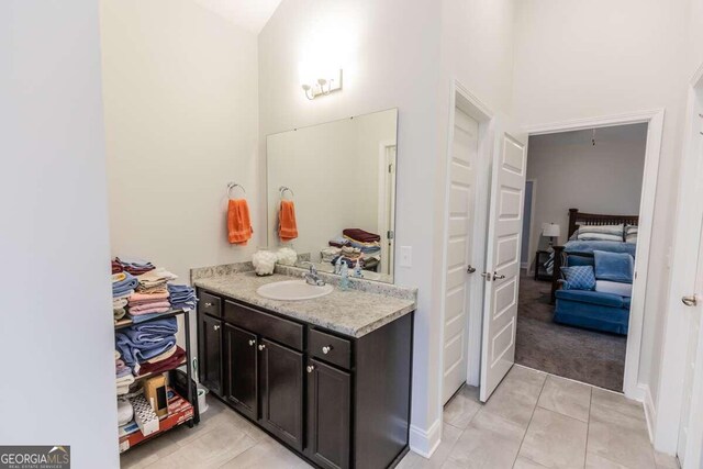 bathroom with vanity and tile patterned floors