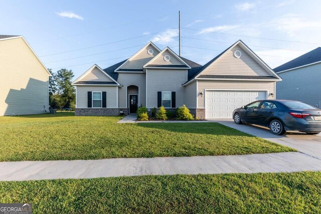 view of front facade featuring a garage and a front lawn