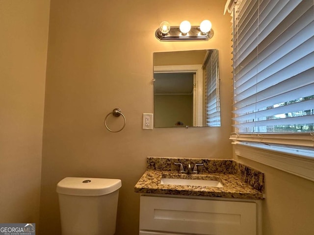 bathroom with vanity and toilet