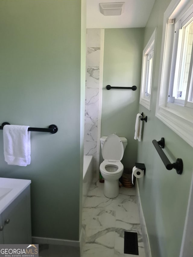 bathroom featuring vanity and toilet